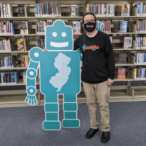 Doug Baldwin stands with New Jersey Makers Day Robot